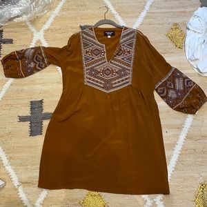 Johnny was dress with embroidery details